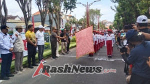 Wujud Cinta Tanah Air, Babinsa Siaga Amankan Lomba Gerak Jalan Pelajar