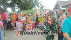 TNI–Polri Turun ke Jalan Amankan Ratusan Warga dalam Lomba Gerak Jalan Cepat Tepat