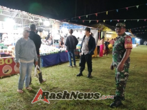 Babinsa Peninjoan dan Bhabinkamtibmas Kompak Jaga Ketertiban Pasar Malam Tembuku Fiesta 2025