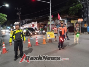 Akibat Pengaspalan Jalan Unit Lantas Polsek Kuta Utara Urai  Arus Lalin Di Simpang Berban