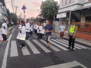 Polsek Kuta Utara Melalui Bhabinkamtibmas Amankan Ibadah Minggu Palma.